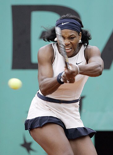 United States player Serena Williams returns the ball to compatriot Ashley Harkleroad during their first round match at the French Open tennis tournament in Paris on May 25, 2008. French Open 2008, Day 1